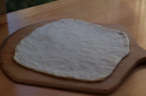 Ungrilled dough on peel