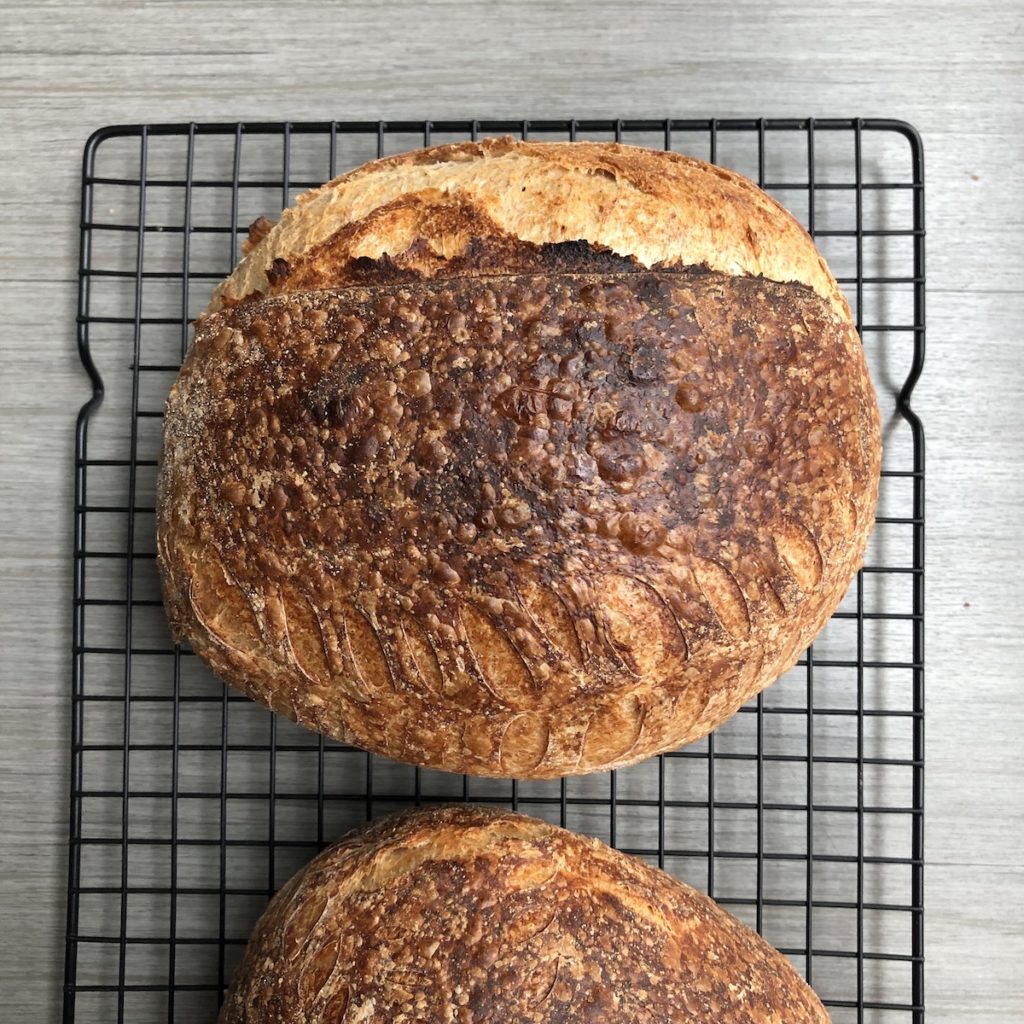 top view of artisan sourdough bread on rack