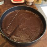 Chocolate ganache spread on cheesecake